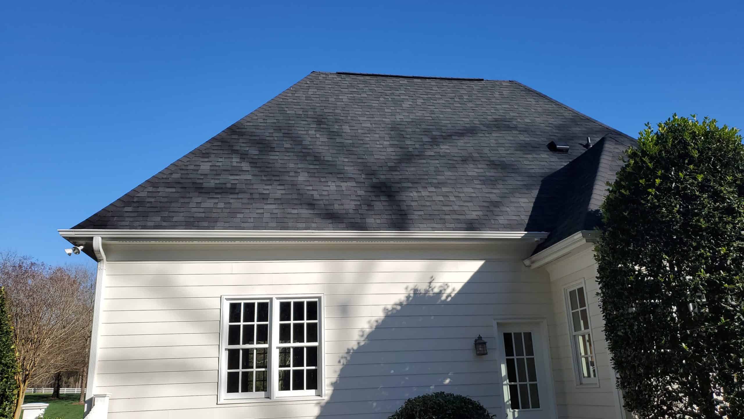 http://side%20view%20of%20white%20residential%20home%20with%20windows%20and%20dark%20asphalt%20shingles