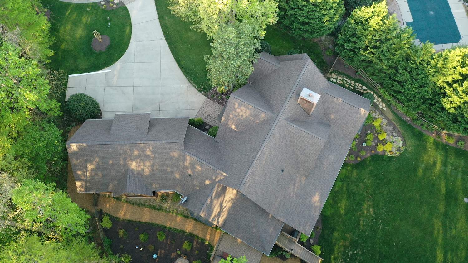 http://top%20aerial%20view%20of%20trudefinition%20duration%20teak%20shingles%20on%20residential%20home%20and%20driveway