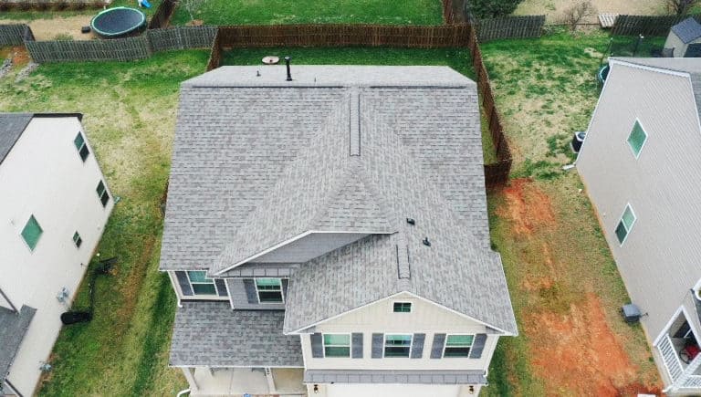 top front aerial view of residential home with oakridge trudef driftwood shingles