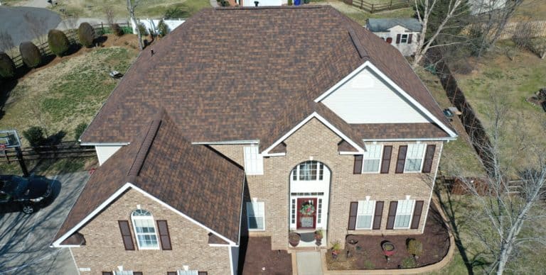 front aerial view of oakridge trudef brownwood shingles on home