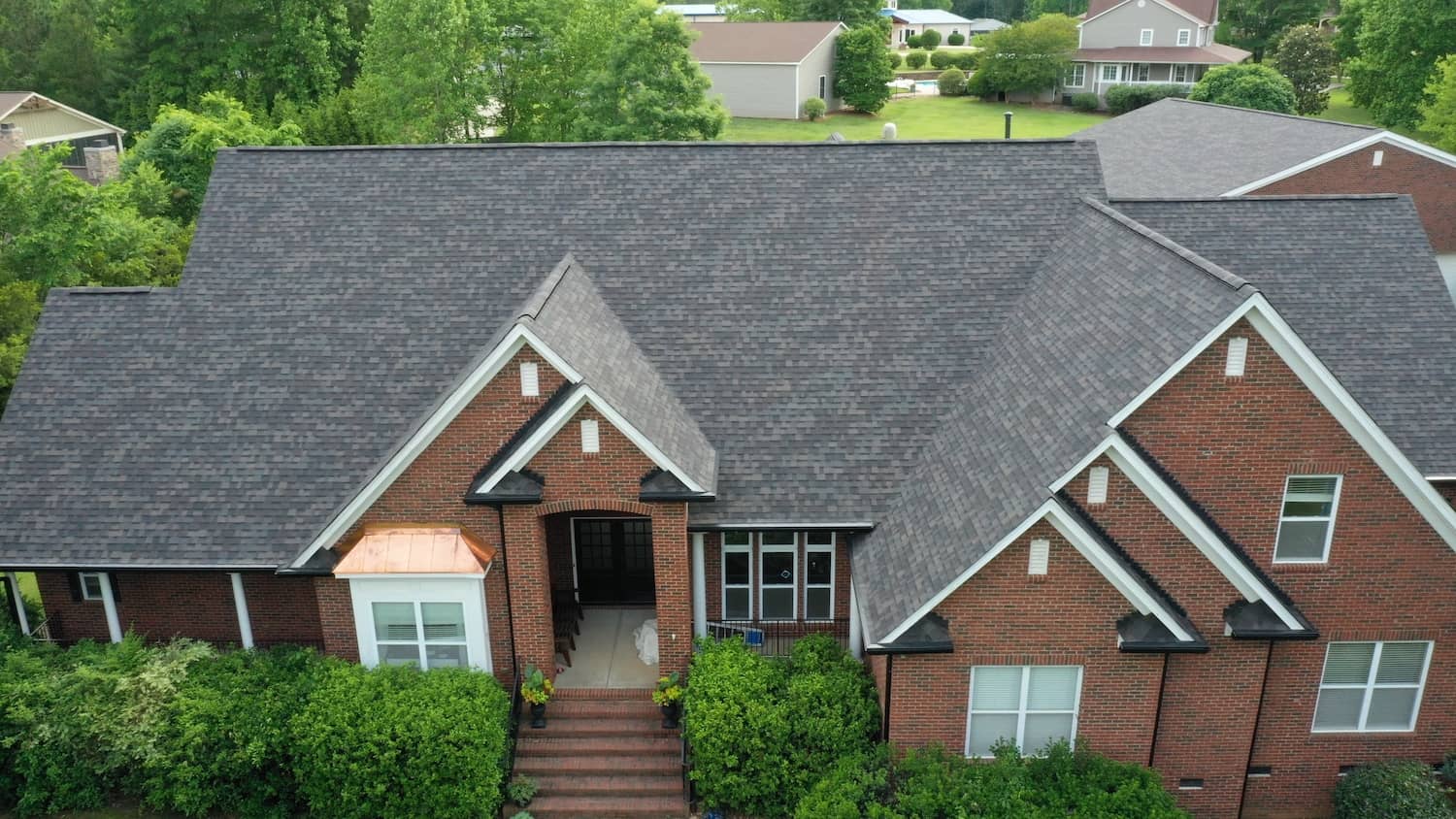 red brick and gray shingle gastonia roofing project