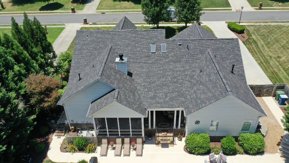 http://backside%20aerial%20view%20of%20residential%20home%20with%20gray%20black%20sable%20duration%20shingles