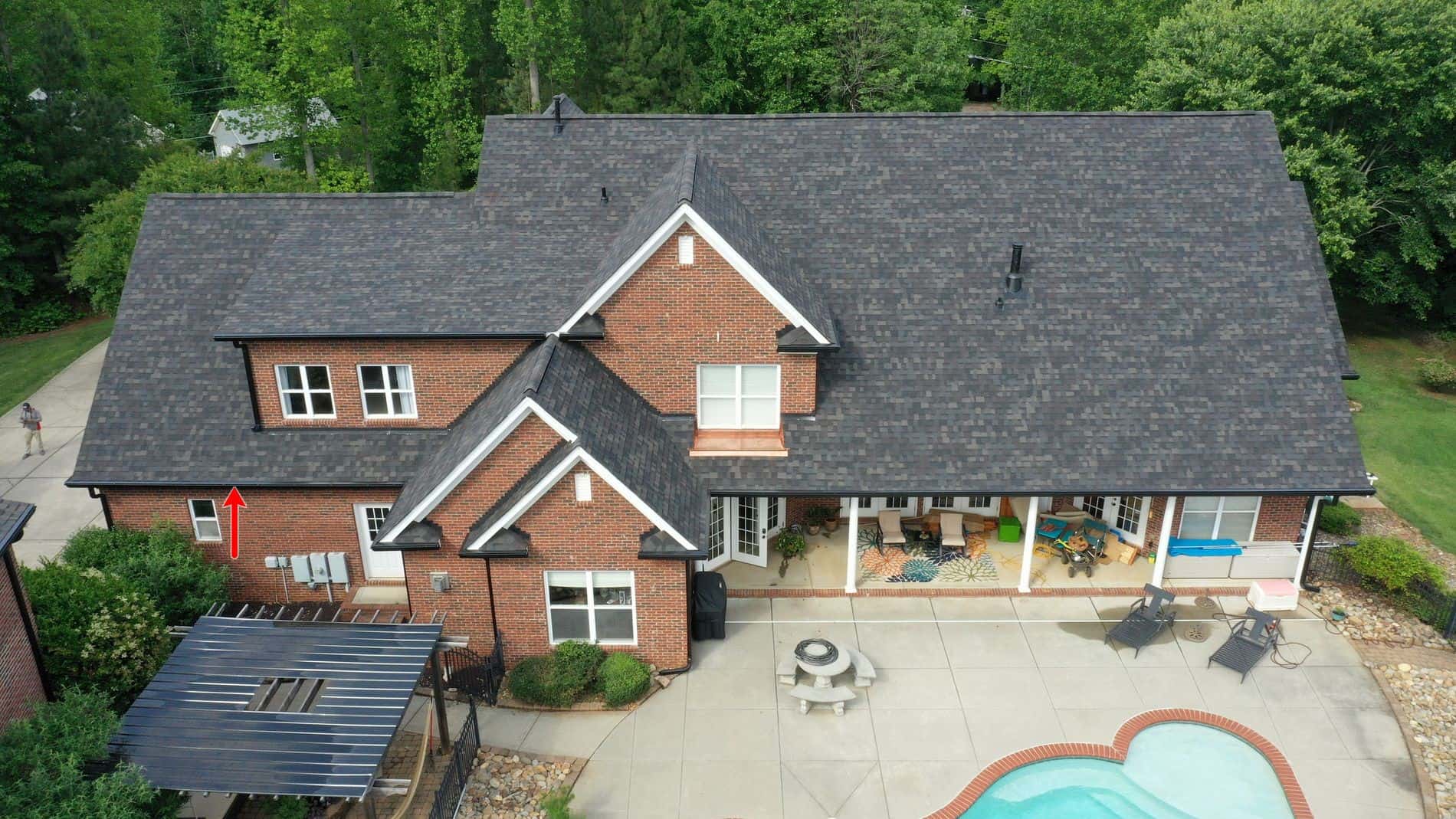http://aerial%20view%20of%20backyard%20with%20pool%20in%20brick%20home
