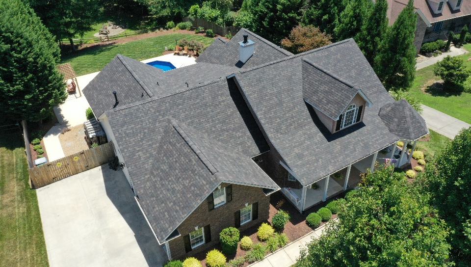 http://left%20side%20aerial%20view%20of%20residential%20home%20with%20black%20sable%20duration%20designer%20shingles