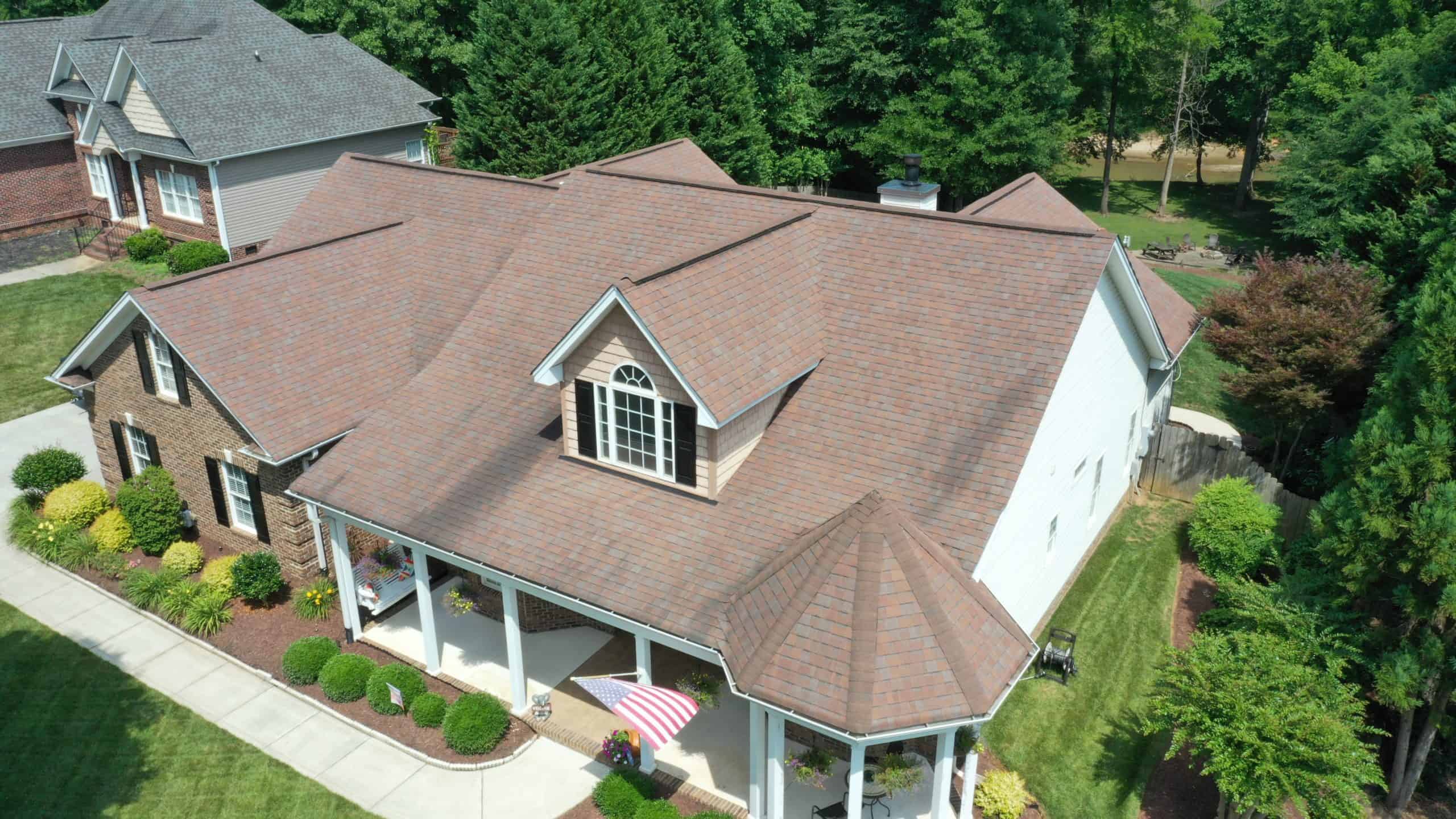 side aerial view of residential home with black sable duration shingles