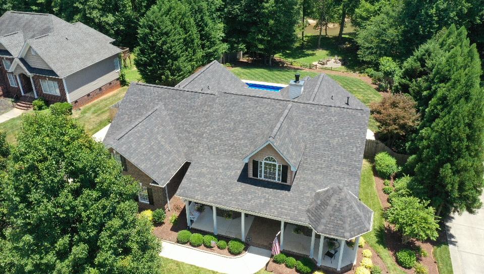 http://front%20right%20aerial%20view%20of%20residential%20home%20with%20gray%20black%20sable%20duration%20shingles