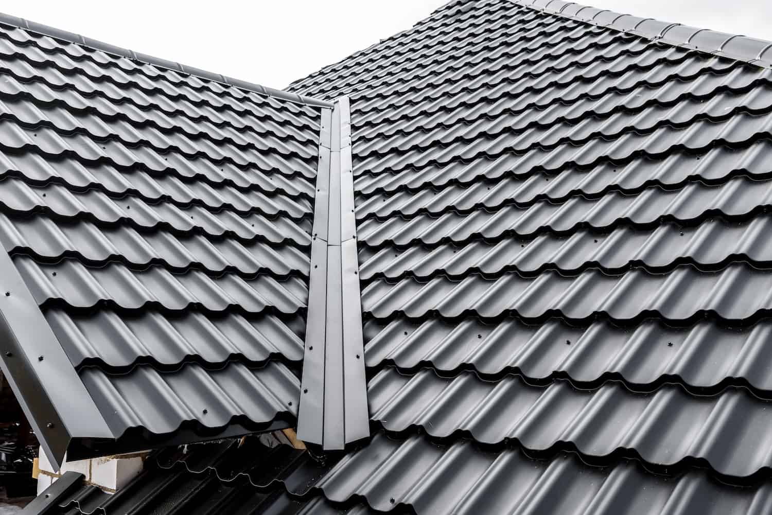 close up view of black metal roofing on house