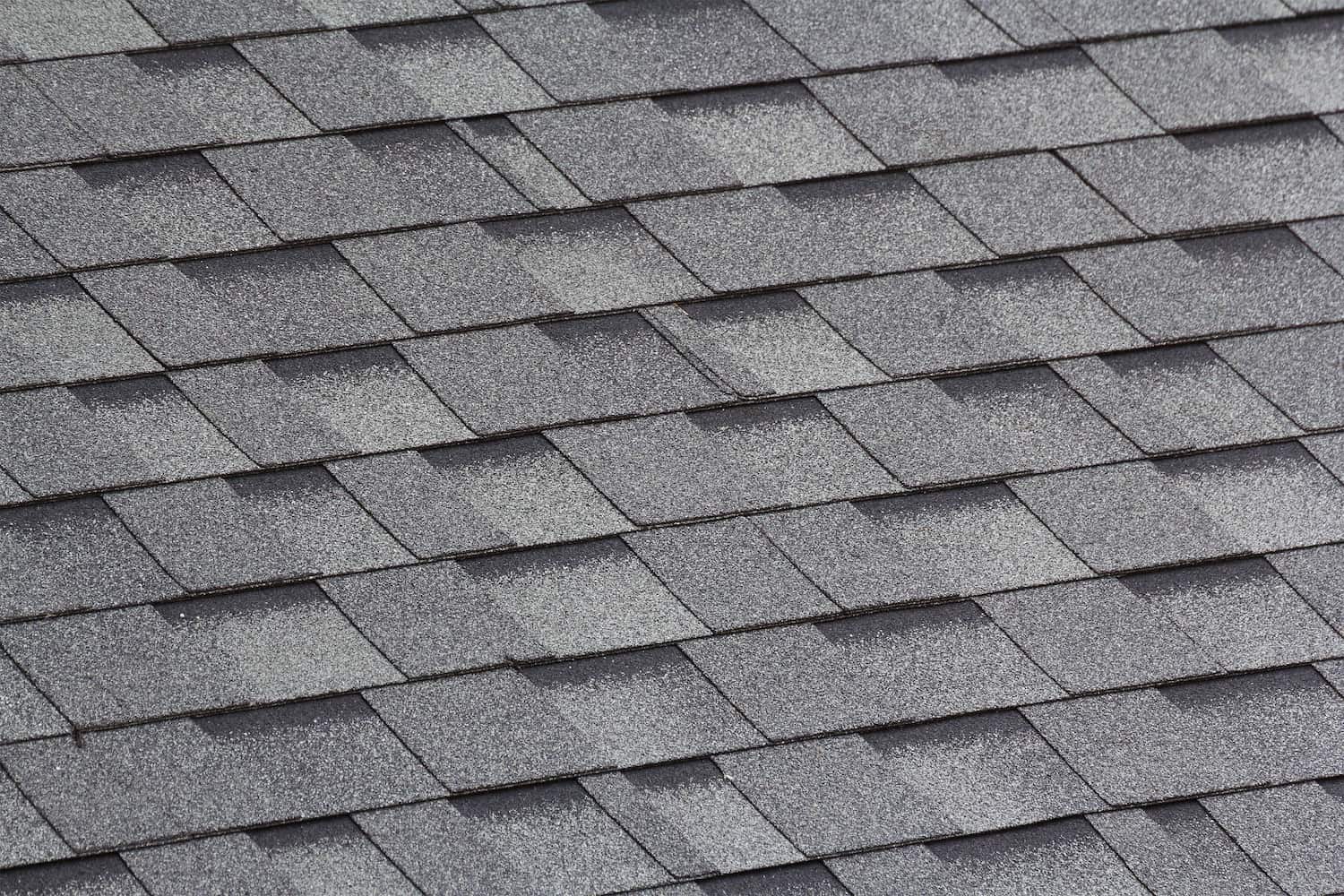 close up view of grey and black roof shingles
