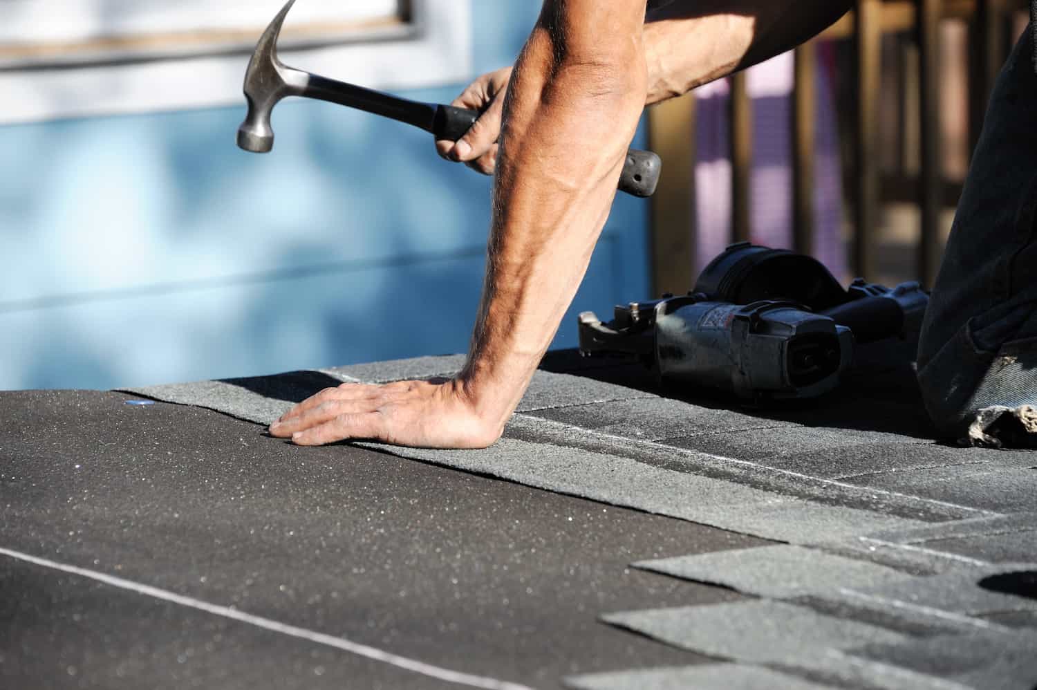 roof repair stanley hammering shingles