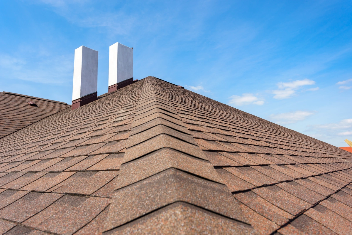 asphalt tile roof with chimney plaza's roofing company