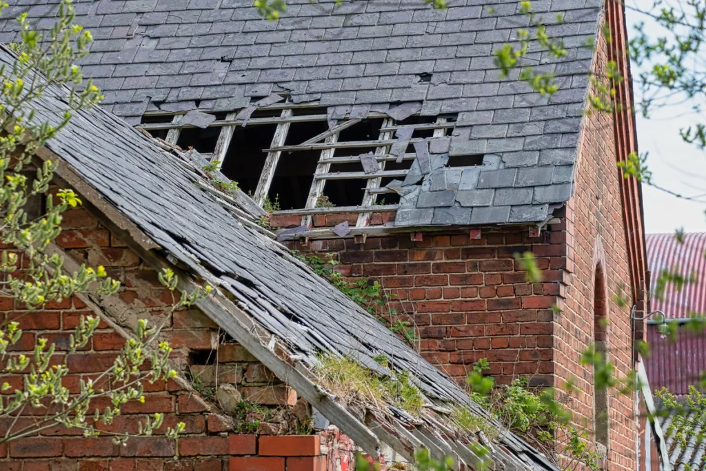 damaged old house with brick walls