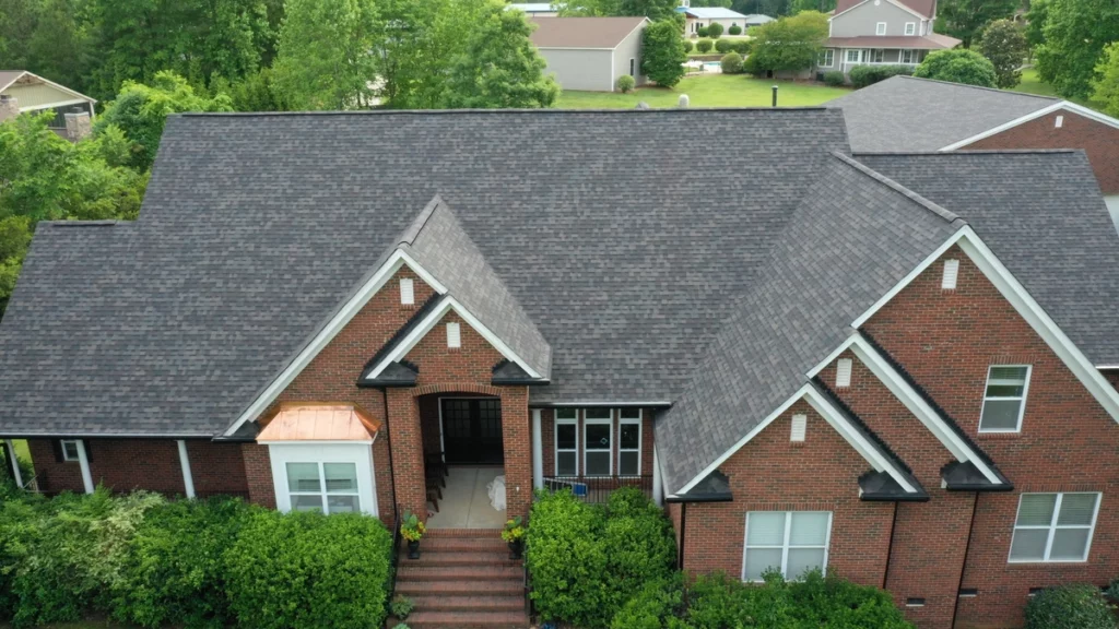 traditional style house with dark asphalt shingle roof