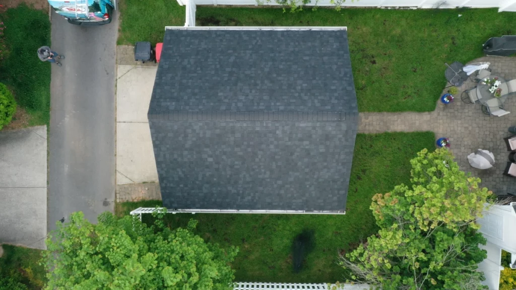 small house in neighborhood with dark roof