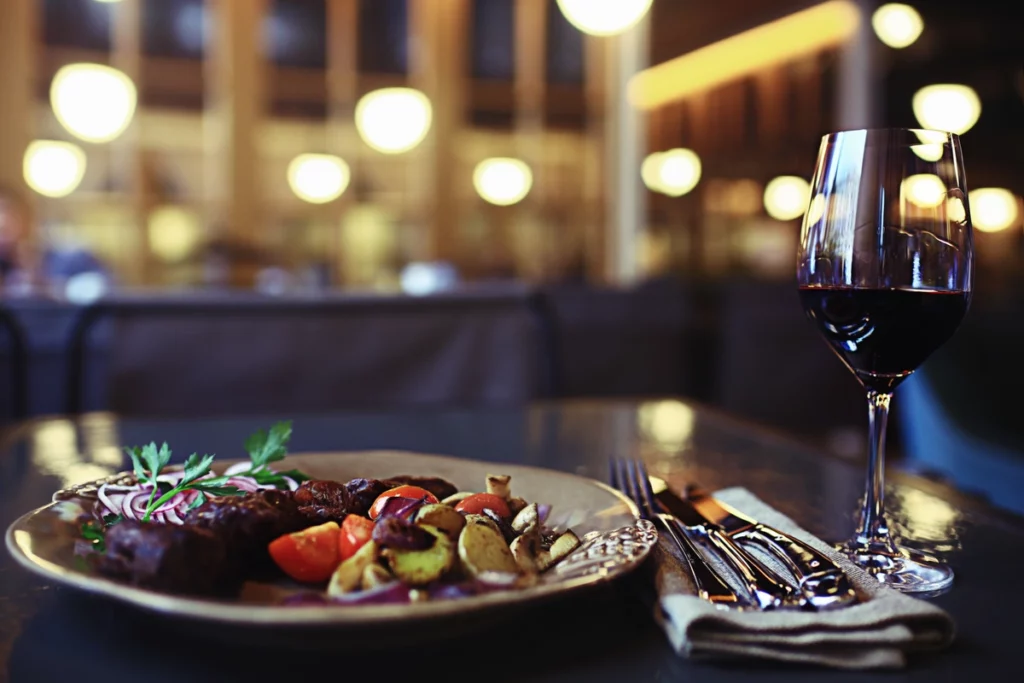 elegant restaurant food steak with vegetables and wine 