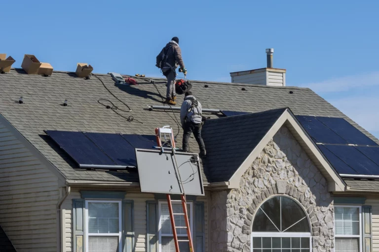 roofing crew working on installing solar panels