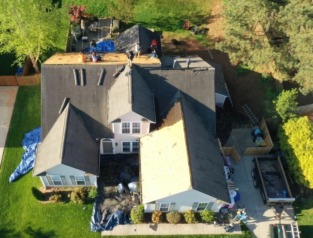 removing the shingles in roof replacement process 
