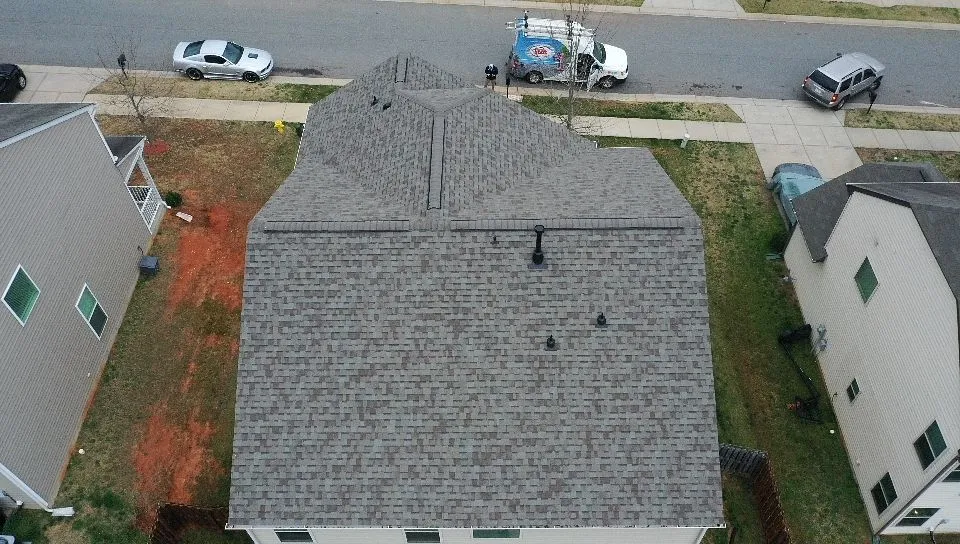 houses next to each other with asphalt shingle roofs
