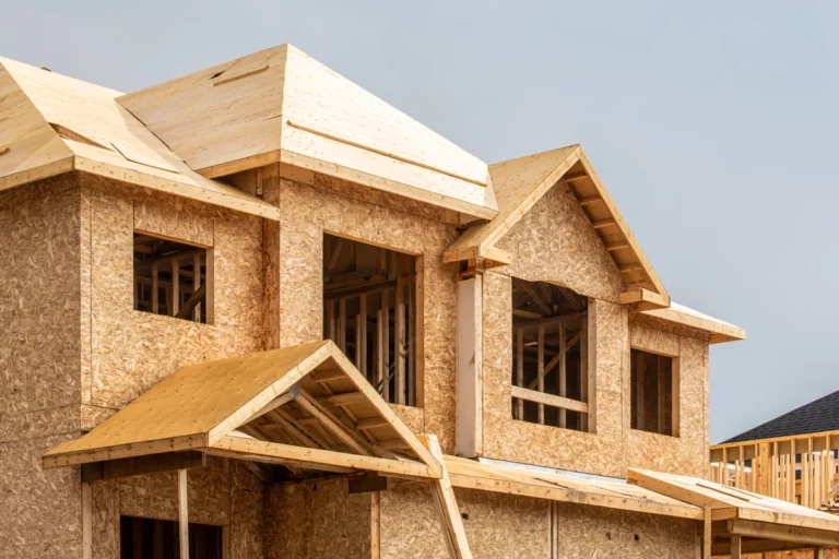 house building process with roof and wall sheathing